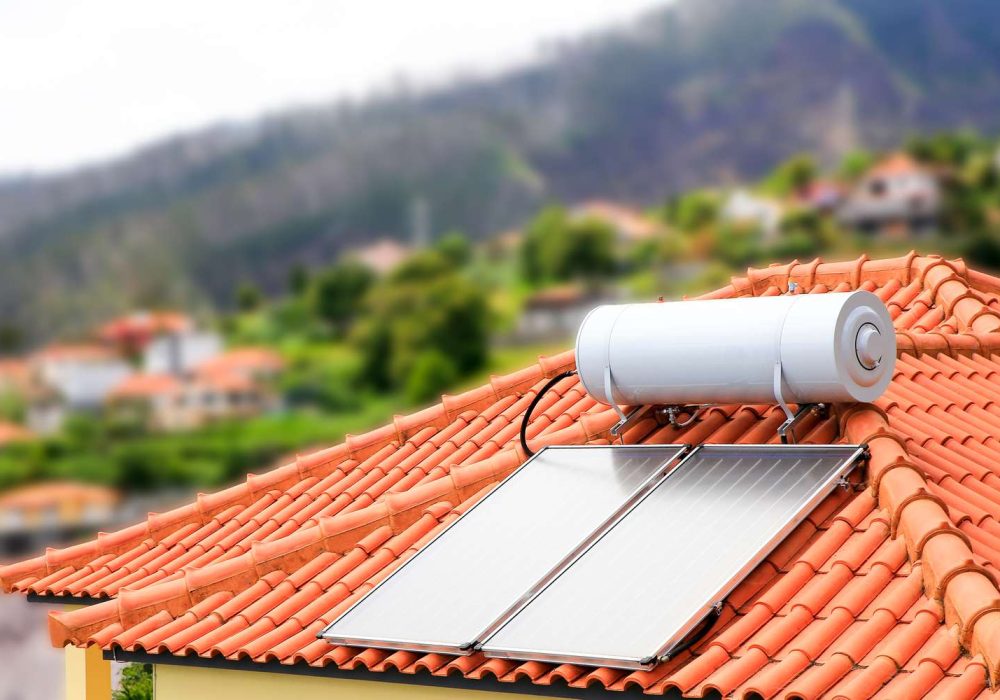 water-boiler-with-solar-panels-on-roof-of-house-588255272-676fafb3bbe44108b6588b0dc2785a2c
